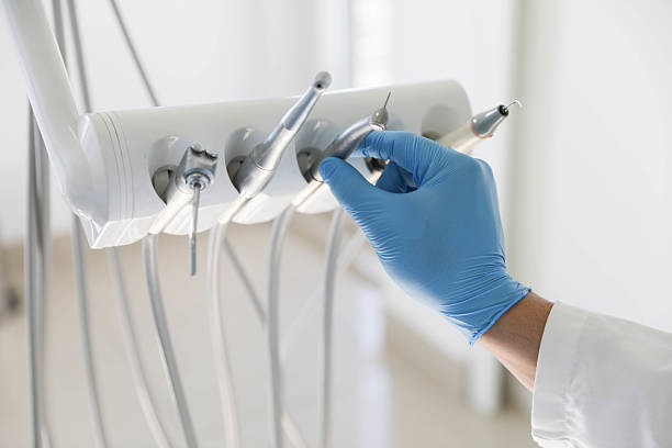 Professional Invisalign Clear Aligners technician working in East Meadow, NY